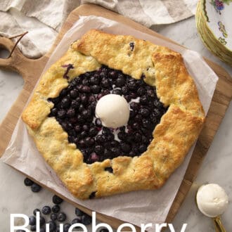 A blueberry galette topped with ice cream.
