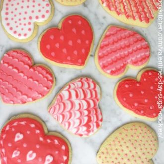 a photo of heart cookies on a marble table