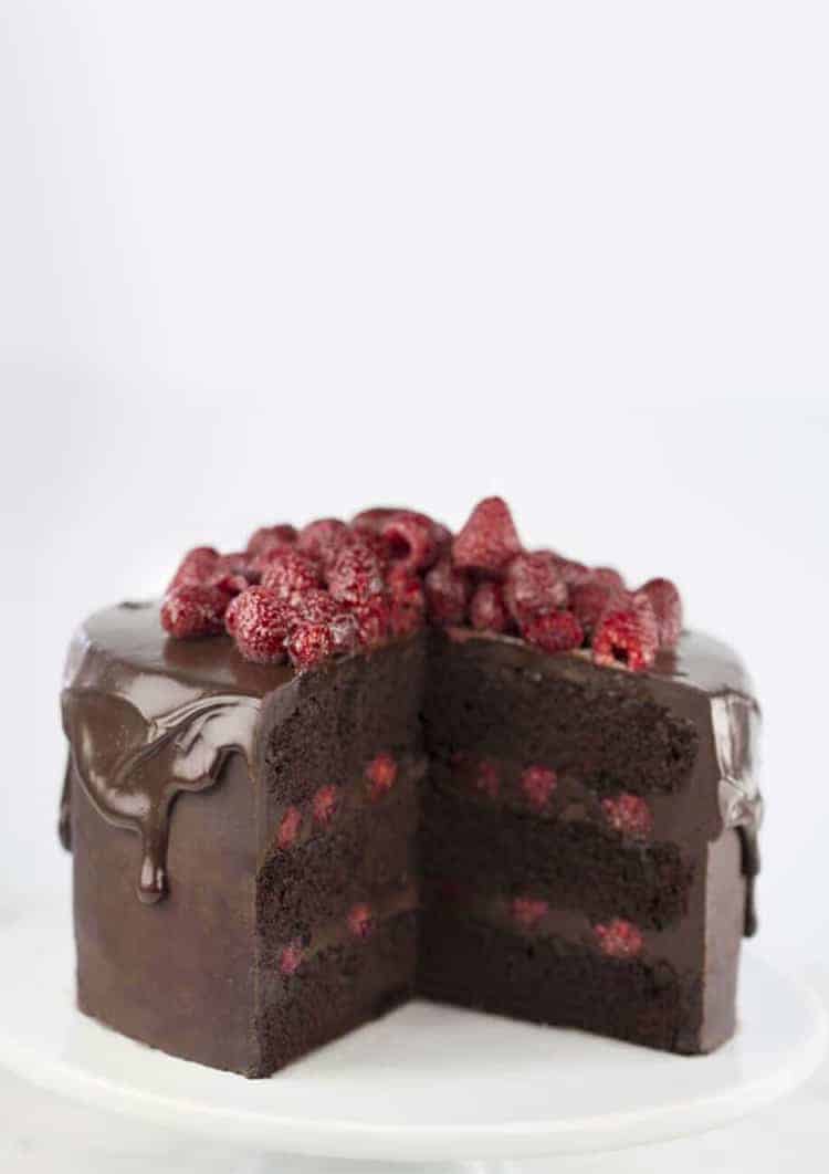 a Chocolate raspberry cake with a few pieces removed