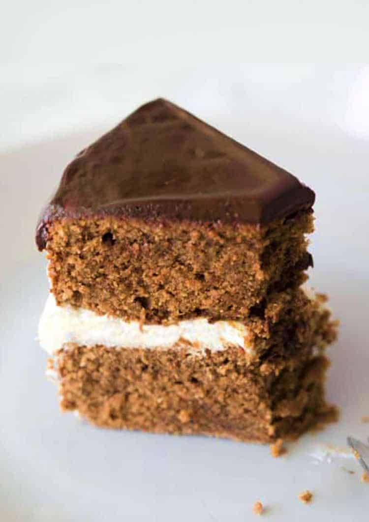 A piece of chocolate marzipan cake with chocolate ganache