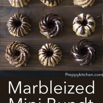 marbelized mini bundt cakes on a dark wood serving board