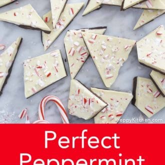 Pinterest graphic of peppermint bark scattered on a marble counter.