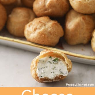 A cheese puffs with a bite taken out.