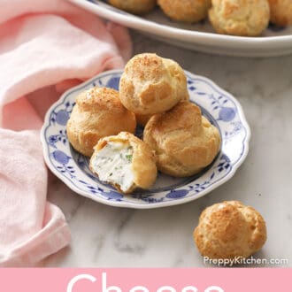 Cheese puffs on a blue and white plate.