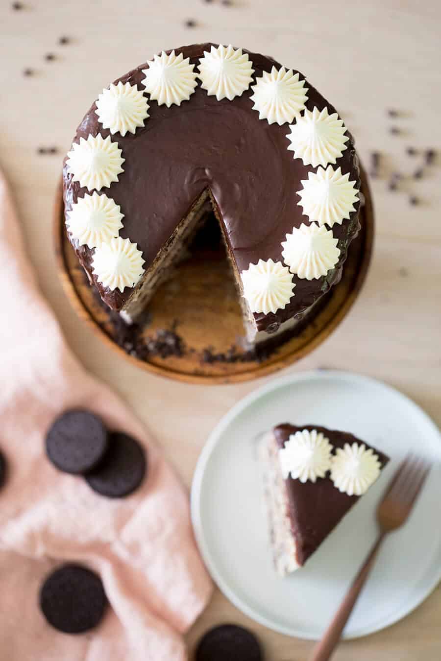 Photo of a Cookies & Cream Cake with a piece out shot from above