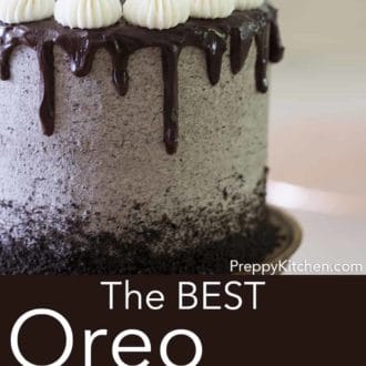 three layer oreo cake with chocolate ganache drip on a cake stand