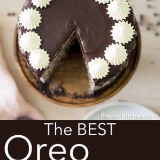 three layer oreo cake with chocolate ganache drip on a cake stand