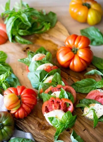 A photo of a delicious caprese salad on a serving board.
