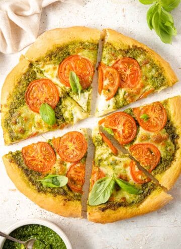 An overhead shot of a pizza cut into slices