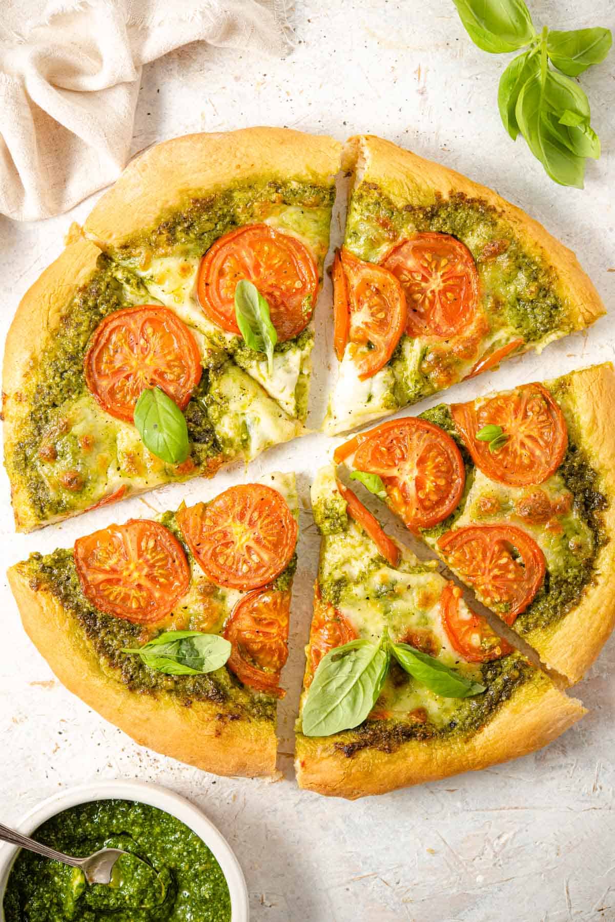 An overhead shot of a pizza cut into slices