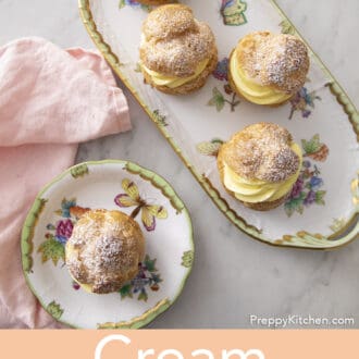 Pinterest graphic of an overhead view of a platter of four cream puffs beside a plate with one.