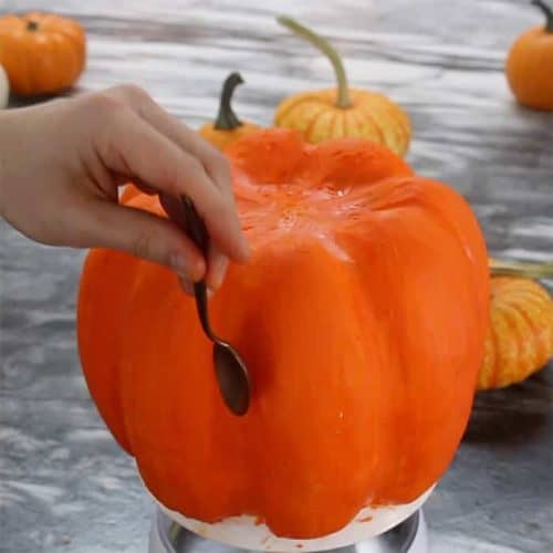 Frosting shaped with a spoon on a pumpkin bundt cake.