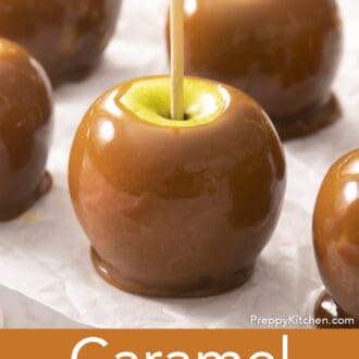 Pinterest graphic of caramel apples on parchment paper.