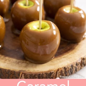 Pinterest graphic of multiple caramel apples on a wooden serving board.