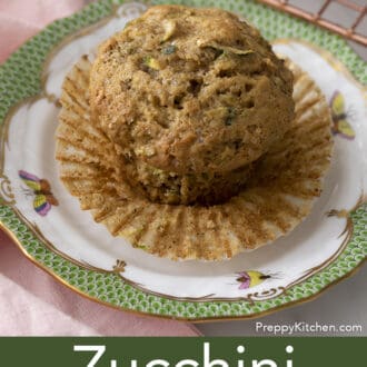 Pinterest graphic of a zucchini muffin on a plate with the paper liner pulled down.