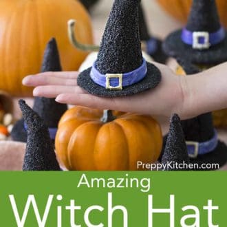 black witch hat cookie in the palm of someones hand