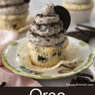 Pinterest graphic of an Oreo cupcake with Oreo frosting on a plate garnished with an Oreo.