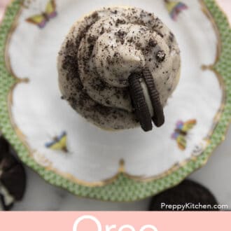 Pinterest graphic of an overhead view of an Oreo cupcake with Oreo frosting on a plate.