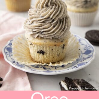 Pinterest graphic of an Oreo cupcake with Oreo frosting on a plate with the paper liner opened.
