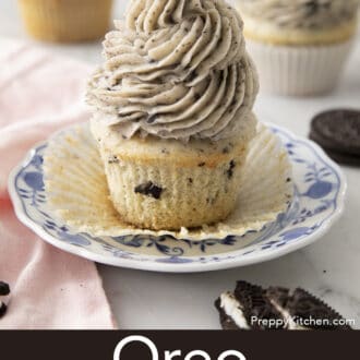Pinterest graphic of an Oreo cupcake with Oreo frosting on a plate with the cupcake liner pulled down.