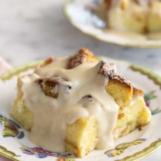 Pinterest graphic of piece of bread pudding on a plate.