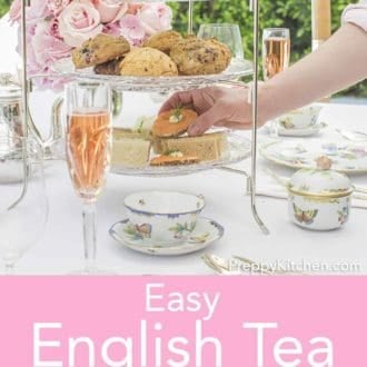 tea sandwiches and small desserts on a tiered stand