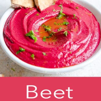beet hummus in a white bowl