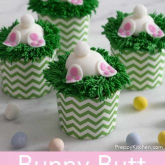 Pinterest graphic of four bunny butt Easter cupcakes with mini chocolate eggs scattered around.
