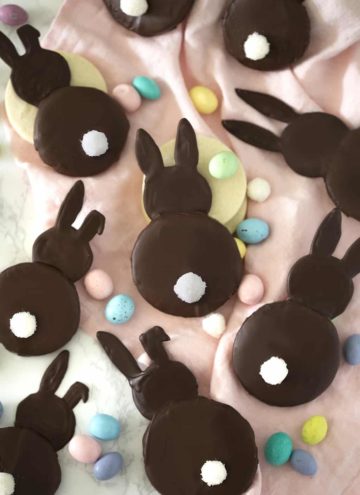 A photo of chocolate coated bunny cookies.