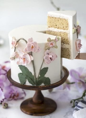 photo of a brown butter Cake on a wooden cake stand
