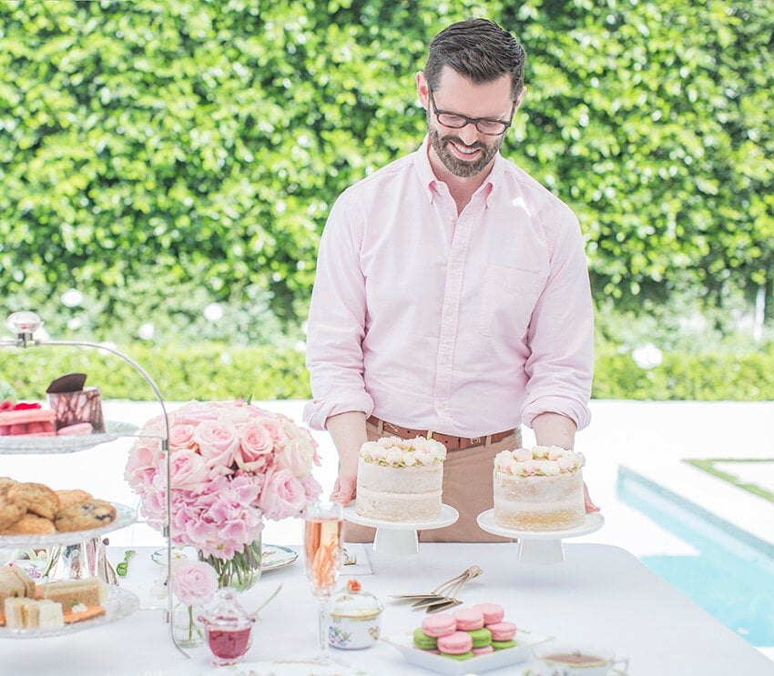 Photo of John placing cakes on table