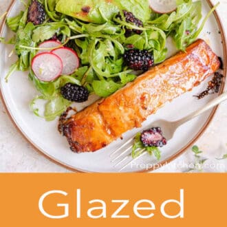 An overhead shot of salmon and salad on a plate with glazed salmon written underneath