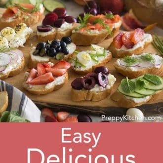 assorted canapes on a wooden serving tray