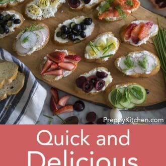 assorted canapes on a wooden serving tray