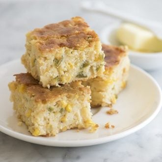photo of moist jalapeño cornbread pudding on a white plate