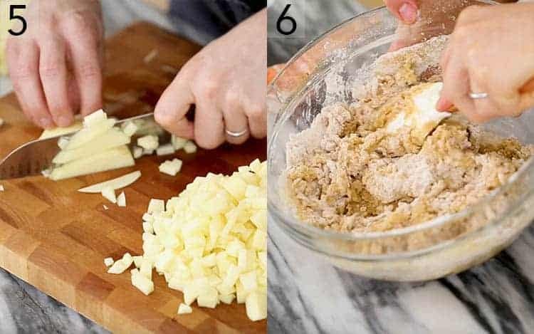 Apples getting chopped on a cutting board.