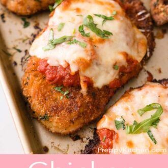 A pinterest graphic of chicken parmesan on a sheet pan.