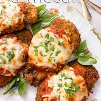 A pinterest graphic of four chicken parmesan on a platter.