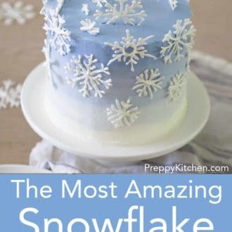 snowflake layer cake on a stand