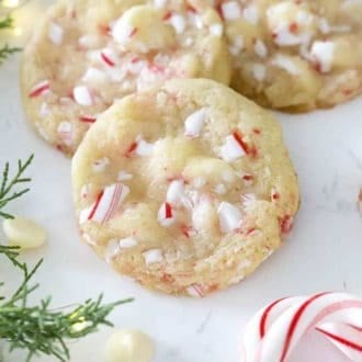 White chocolate peppermint cookies on a marble surface.
