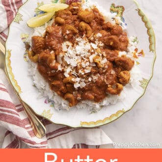 Butter chicken with rice on a plate.