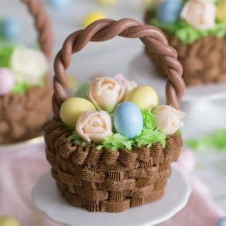 Chocolate Easter basket cupcakes filled with candy eggs and flowers.