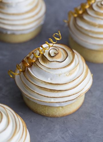 A chocolate tart topped with a perfect spiral of toasted meringue and a sugar corkscrew.