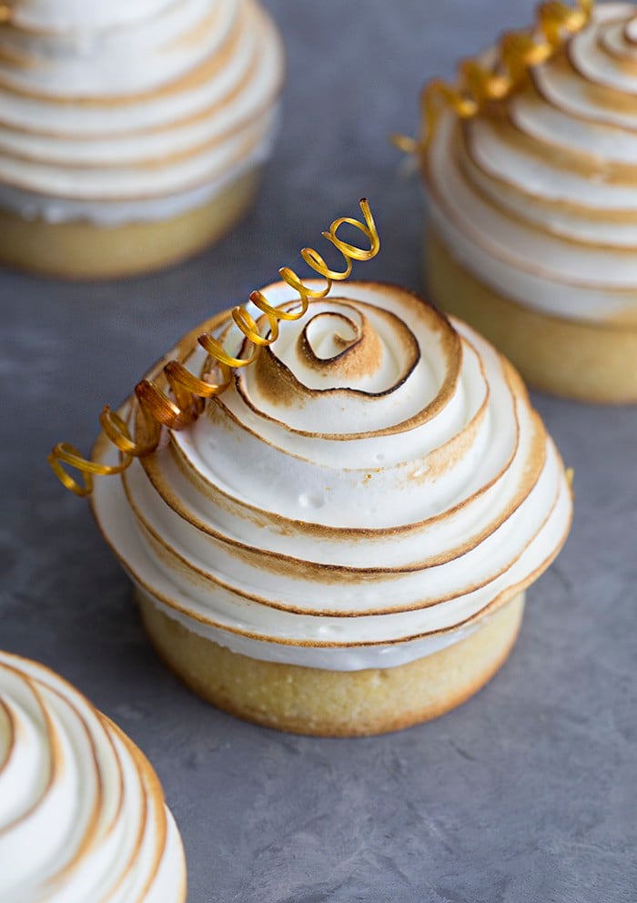 A chocolate tart topped with a perfect spiral of toasted meringue and a sugar corkscrew.