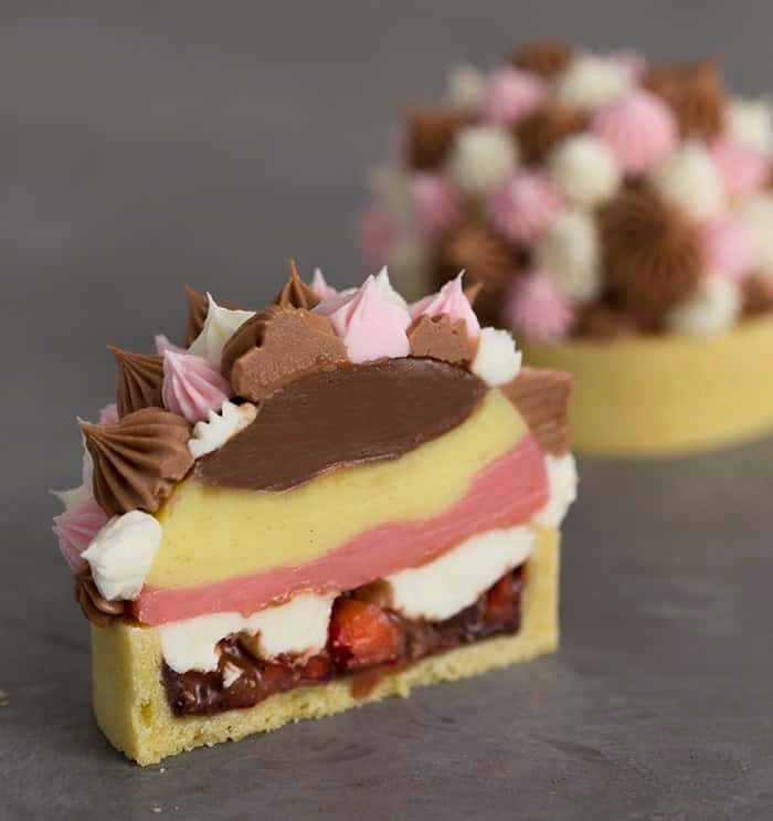 A photo of a Neapolitan tart cut in half.