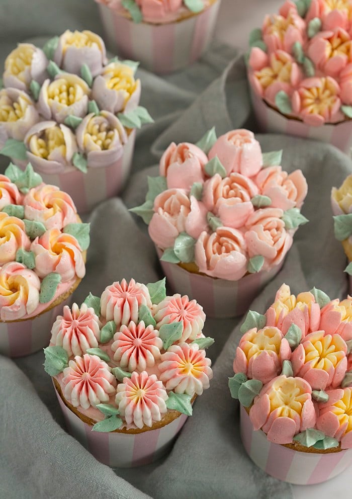 a photo of cupcakes topped with buttercream flowers using Russian piping tips