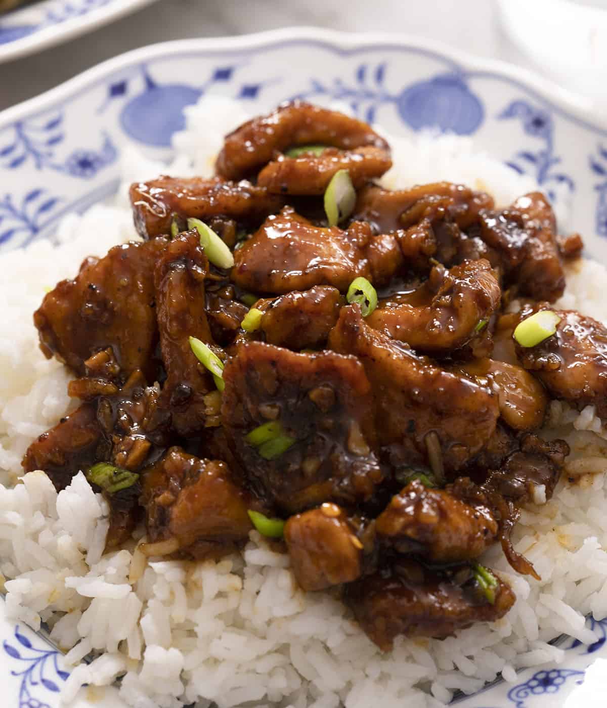 A close up of Bourbon Chicken on top of rice