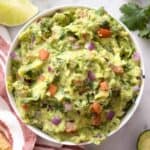 A close up of a bowl of guacamole