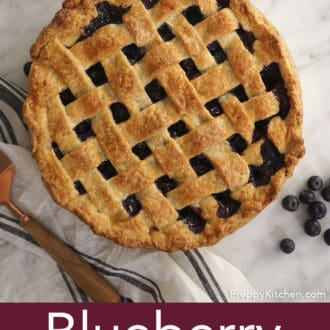 Pinterest graphic of an overhead view of a blueberry pie on a counter with blueberries scattered.