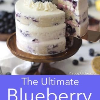 three layer lemon blueberry cake on a cake stand